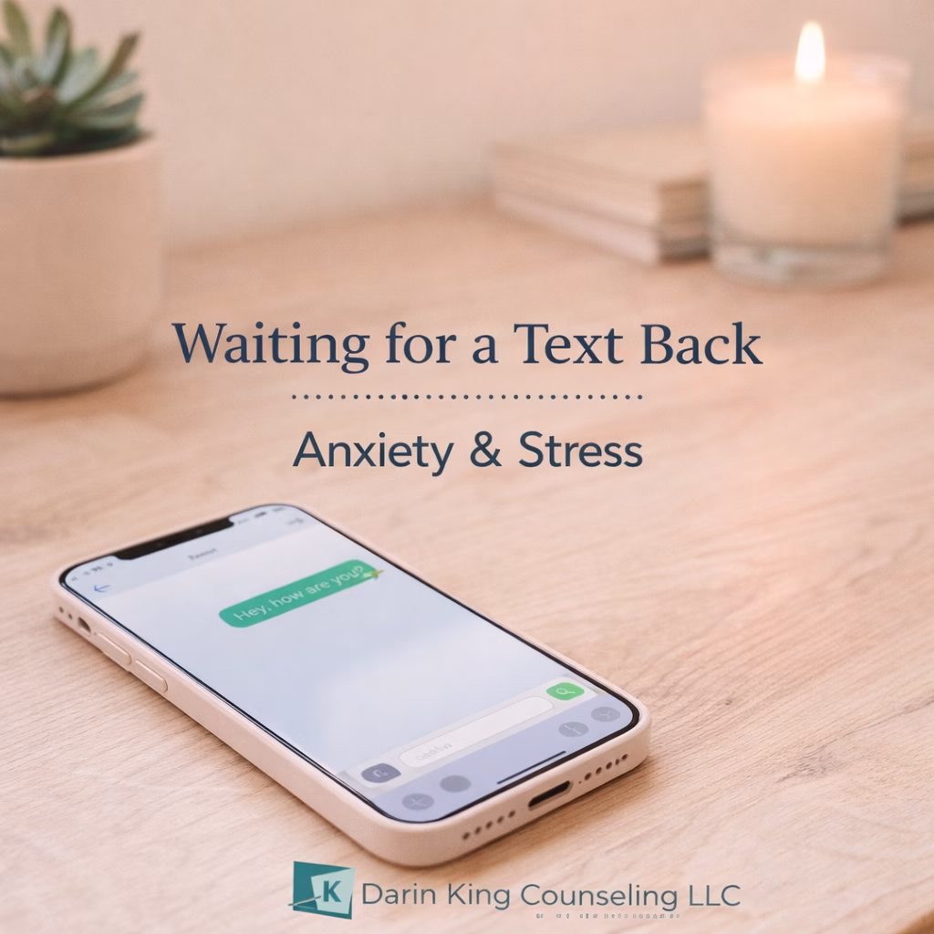 Person feeling anxious while waiting for a text message response on their phone