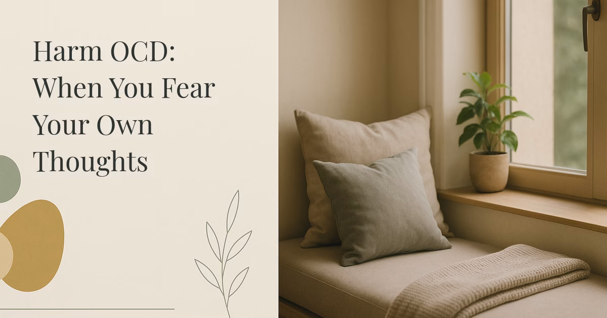 A soft sunlit cushioned window seat with pillows, a folded blanket, and a plant, a calm reassuring space evoking relief for someone with harm OCD.